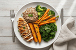Balanced meal prep plate with protein, vegetables, and rice