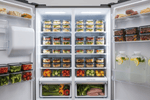 Meal prep containers neatly organized in refrigerator