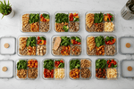 Portion-controlled meal prep containers neatly arranged