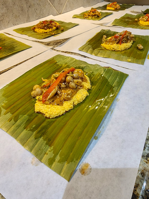 “Traditional Puerto Rican pasteles wrapped in banana leaves handmade weekly by Chef Shaby y Su Mai”