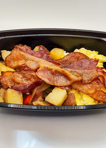 Scrambled eggs with bacon in a meal prep breakfast container