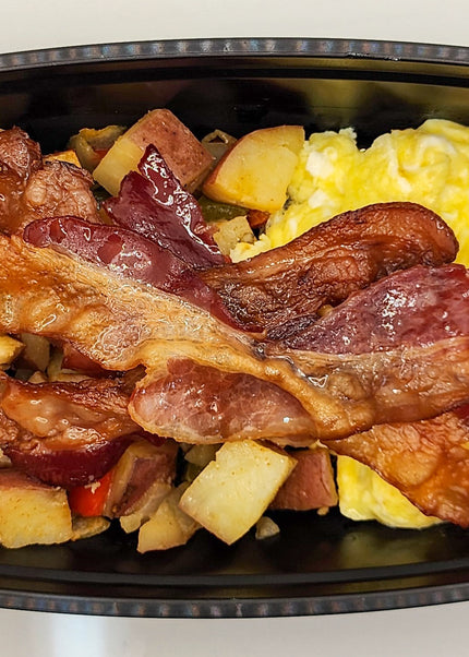 Scrambled eggs with bacon in a meal prep breakfast container