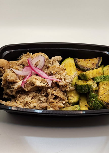 Pulled carnitas pork with seasoning in a Chef Shaby meal prep container