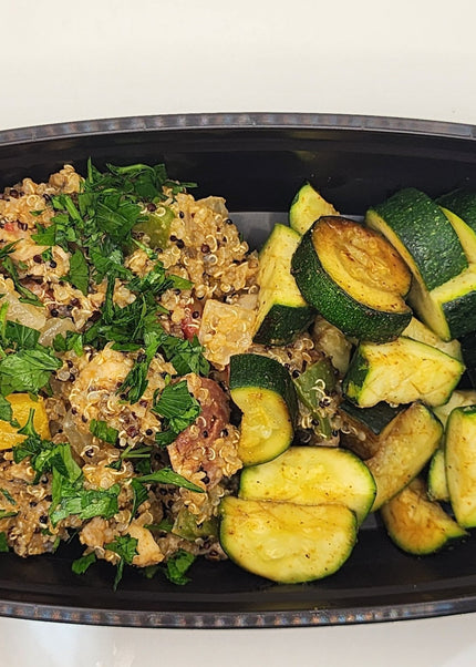 Chicken and sausage jambalaya with seasoned rice in a Chef Shaby meal prep container