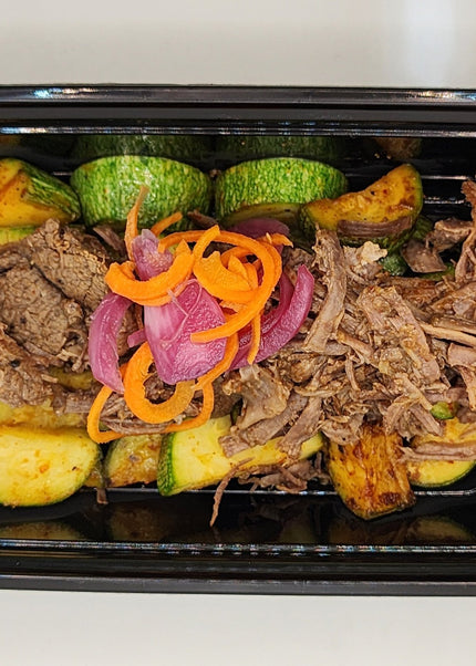 Shredded beef barbacoa with rich seasoning in a Chef Shaby meal prep container