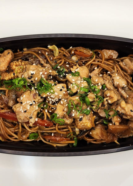 Pork lo mein noodles with vegetables in a meal prep container