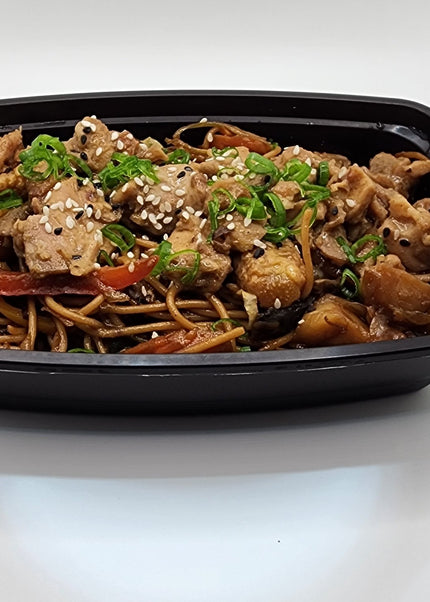 Pork lo mein noodles with vegetables in a meal prep container