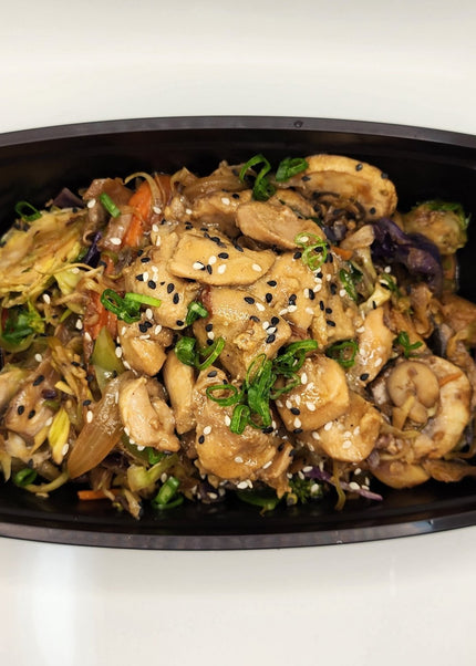 Pork lo mein noodles with vegetables in a meal prep container