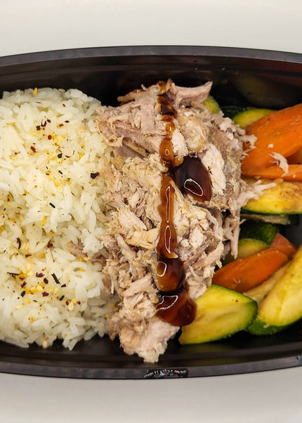 Hawaiian pork with pineapple glaze in a meal prep tray