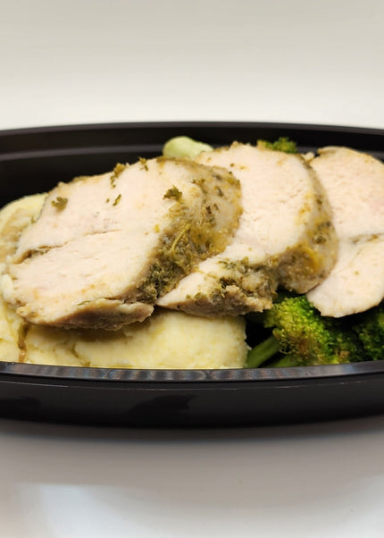 Herb seasoned chicken breast sliced in a Chef Shaby meal prep container