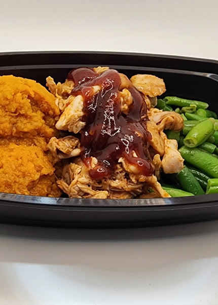 Shredded BBQ pork with smoky sweet sauce in a Chef Shaby y Su Mai meal prep tray