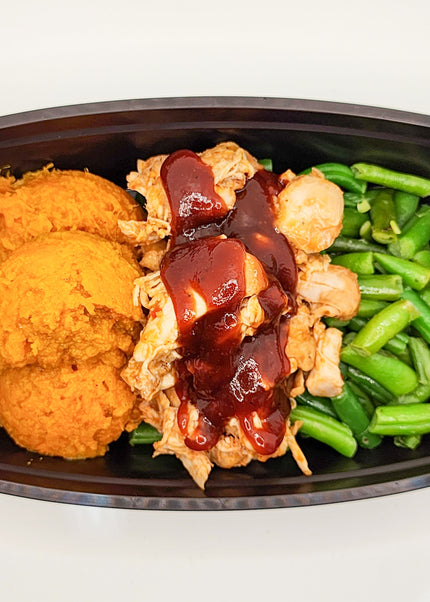 BBQ chicken breast with smoky sweet sauce in a meal prep container