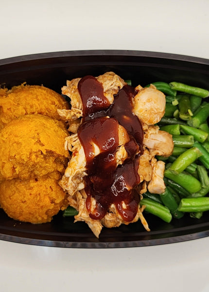 Shredded BBQ pork with smoky sweet sauce in a Chef Shaby y Su Mai meal prep tray