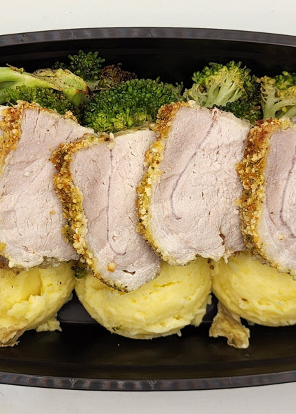Parmesan crusted pork cutlet baked golden in a meal prep container