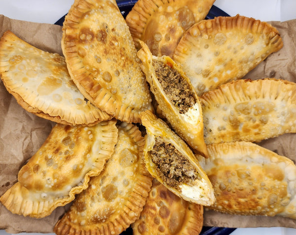 “Puerto Rican empanadilla preñá filled with meat and cheese made fresh by Chef Shaby y Su Mai in Denton Texas”