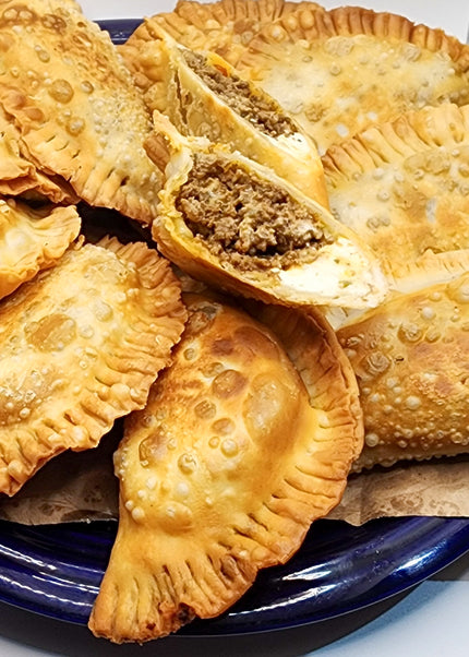 “Puerto Rican empanadilla preñá filled with meat and cheese made fresh by Chef Shaby y Su Mai in Denton Texas”