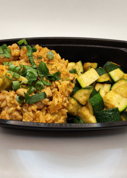 Chicken and sausage jambalaya with seasoned rice in a Chef Shaby meal prep container