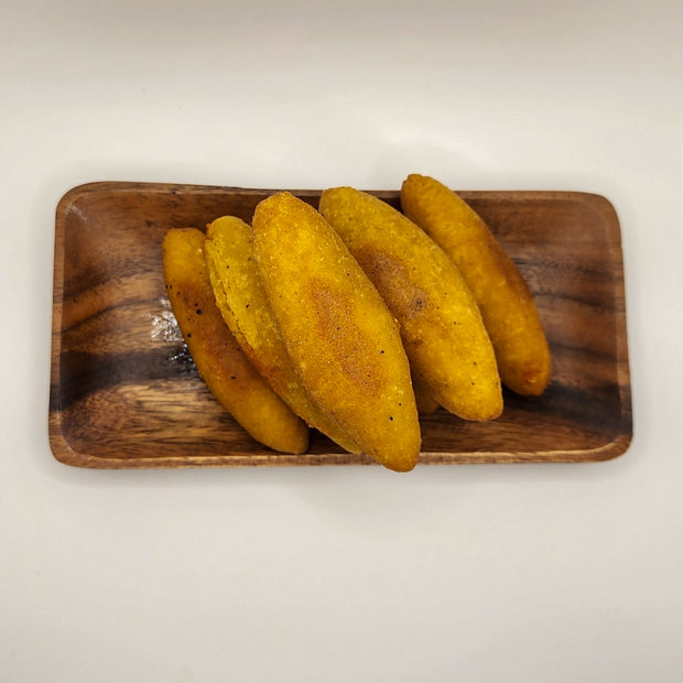 Fresh fried sorrullitos prepared for weekly Puerto Rican inspired meal prep in Denton Texas