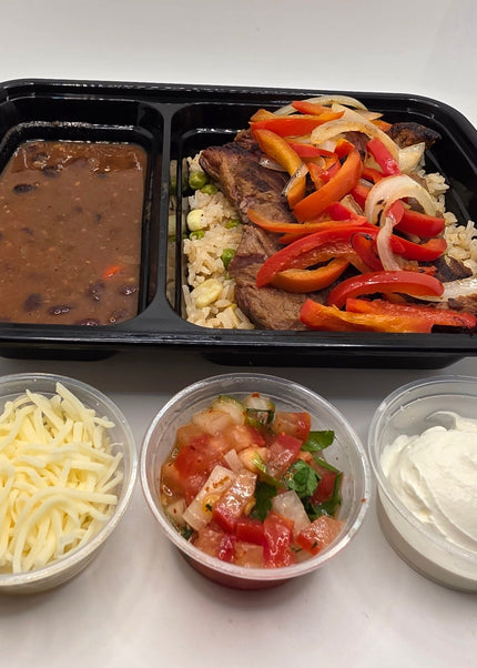 Beef fajita bowl with peppers onions and rice prepared fresh by Chef Shaby y Su Mai in Denton Texas